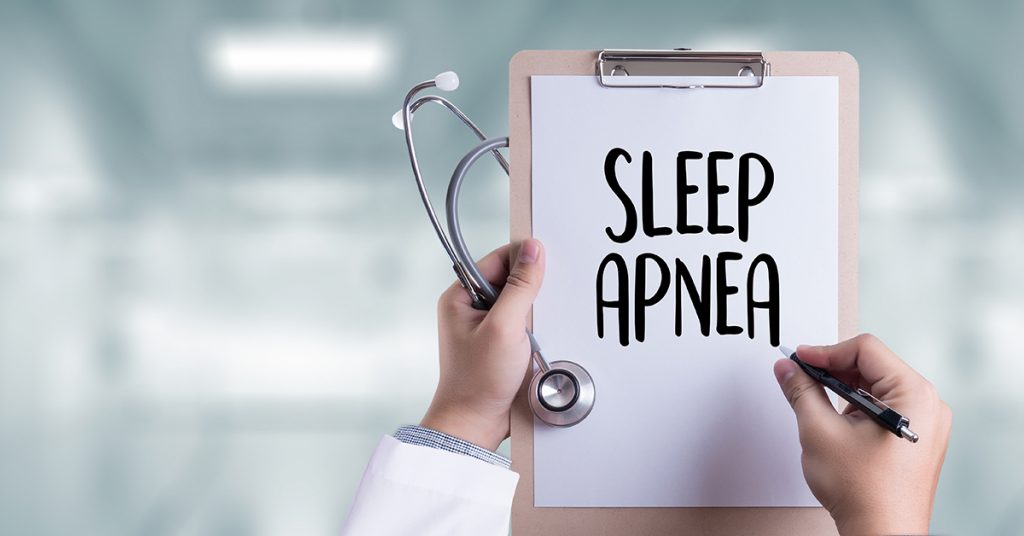Doctor Diagnosing Sleep Apnea
