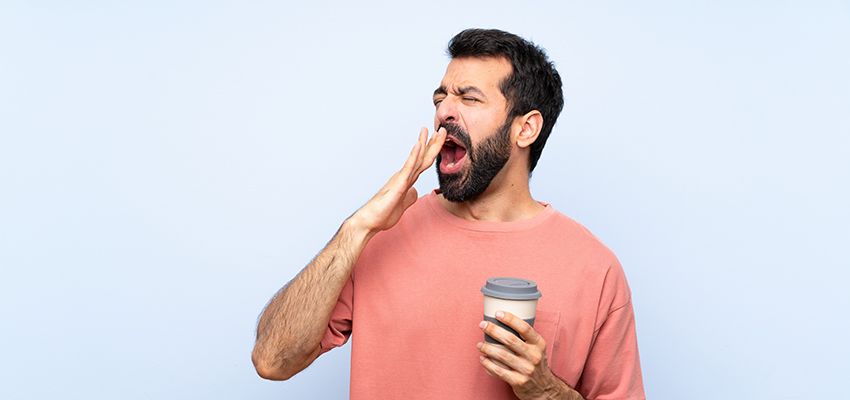 Yawning Man with a Coffee