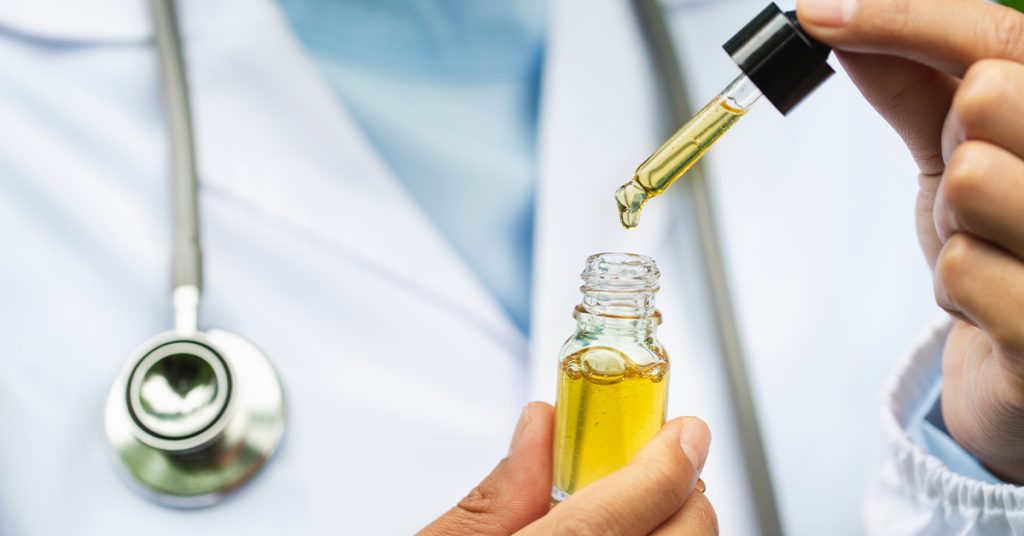 Doctor holding CBD oil