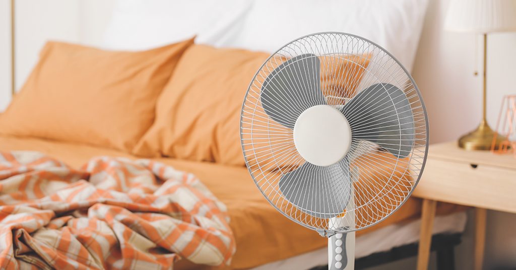 Electric Fan Next to Bed